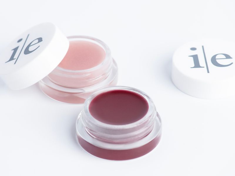 Two Lip Elixir lips balms in color sheer and plum