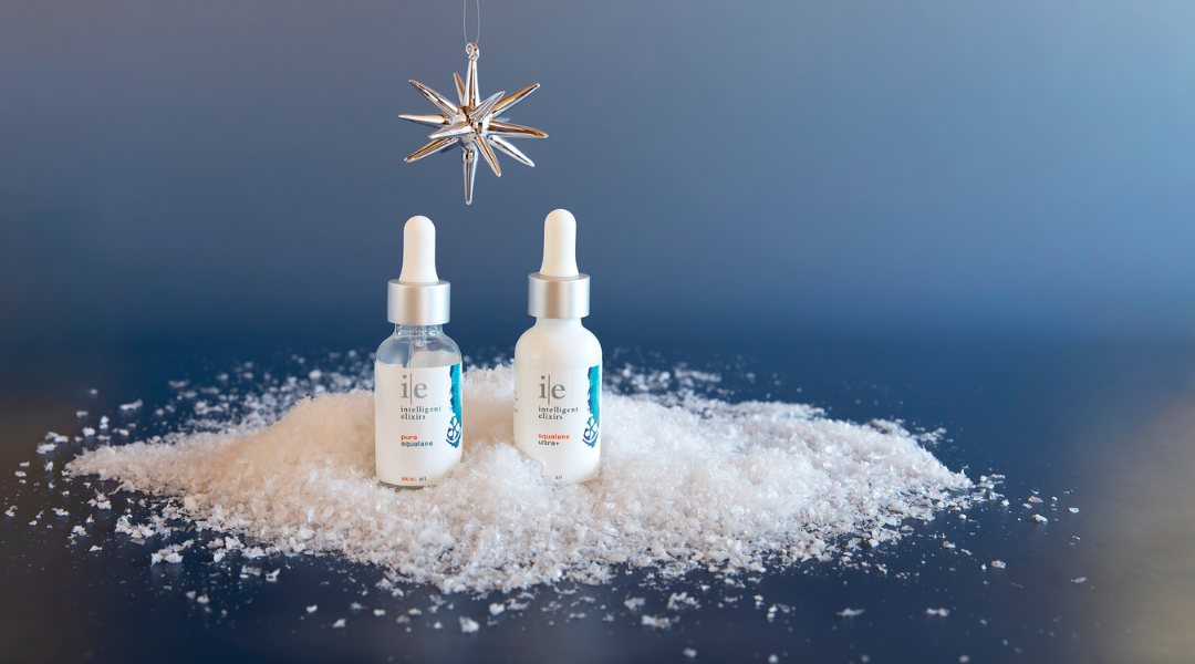 Vitamin B-5 Skincare Serum sitting on a counter with a plant