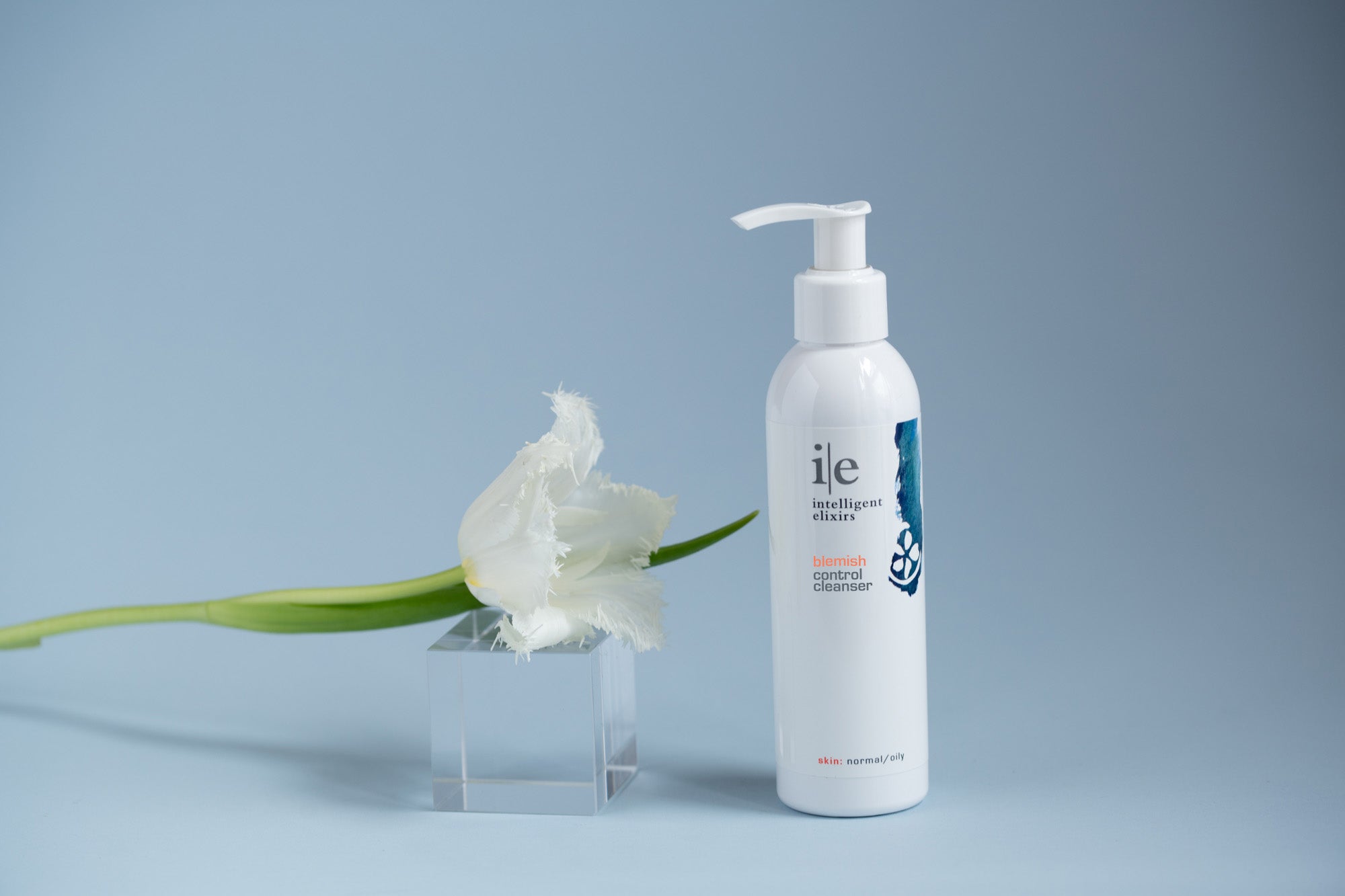 Blemish Control Cleanser for blemish-prone or oily skin next to a flower