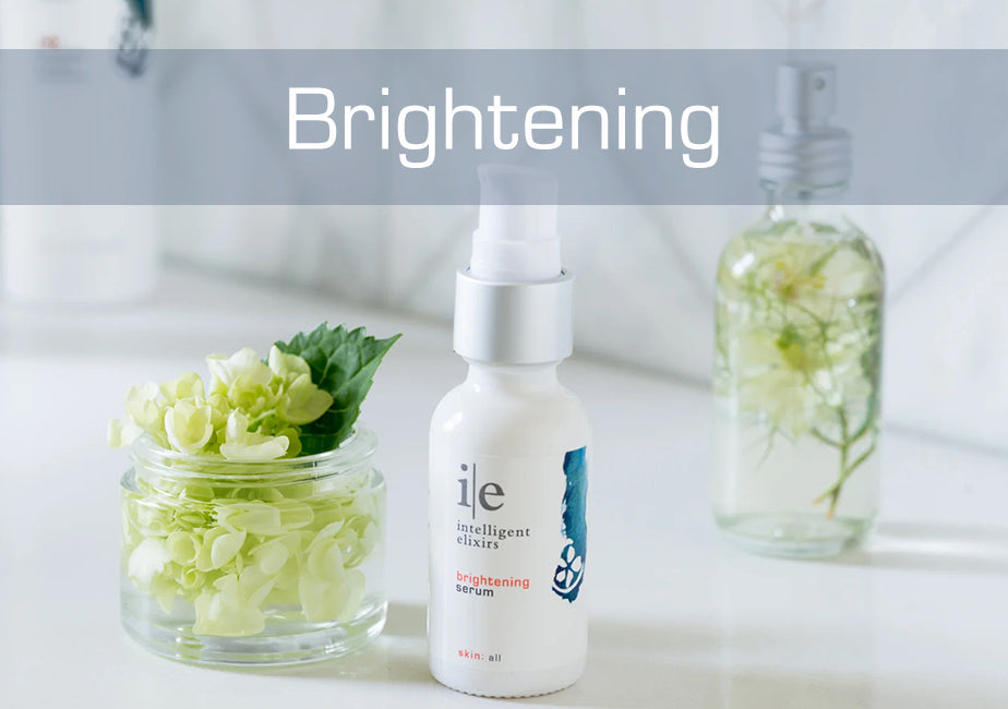 Brightening skincare solutions for dull or pigmented skin and Brightening Serum next to a flower in a jar